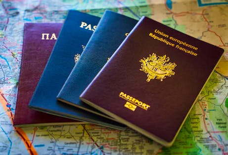 former Chinese nationals - passports on a map